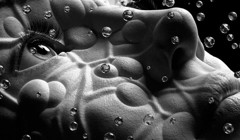 a black and white photo of water bubbles